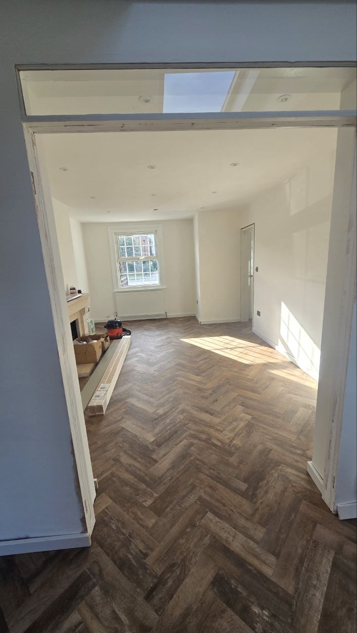 Kitchen refurbishment with new cabinetry, island and herringbone flooring